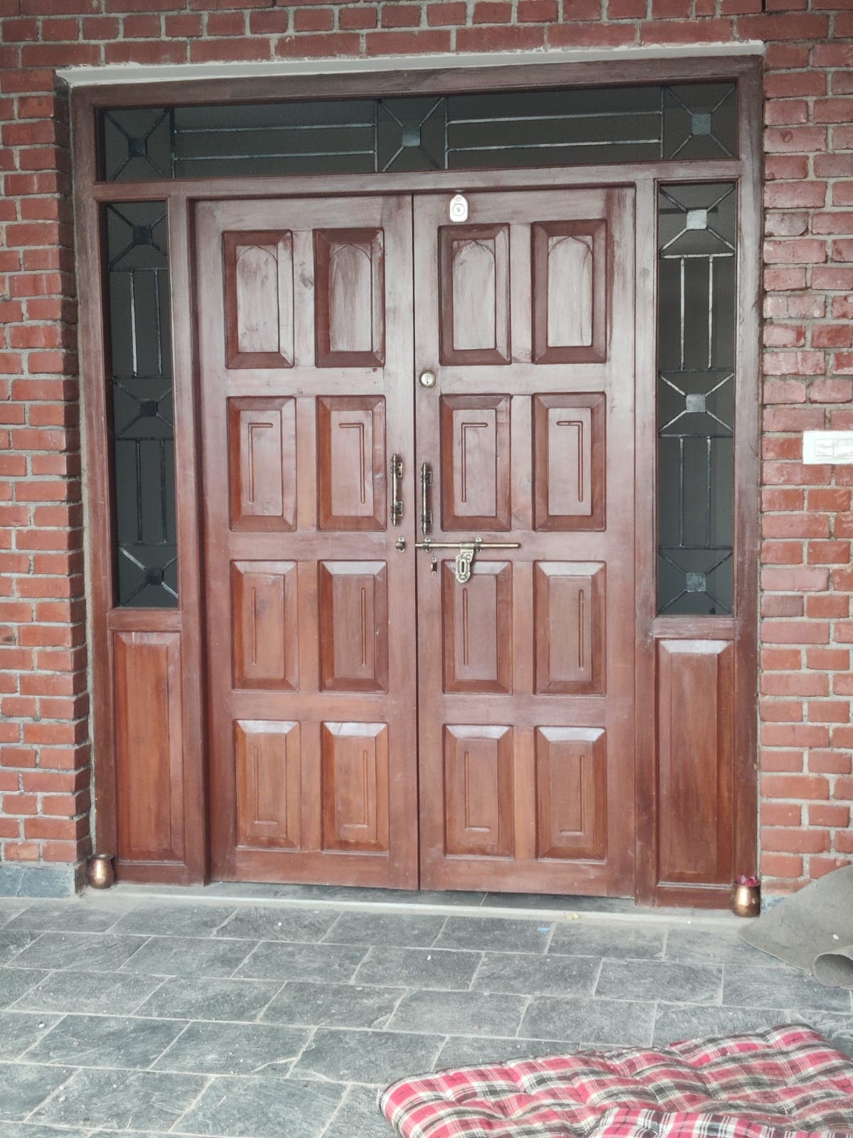 Custom wooden entrance door with glass side panels